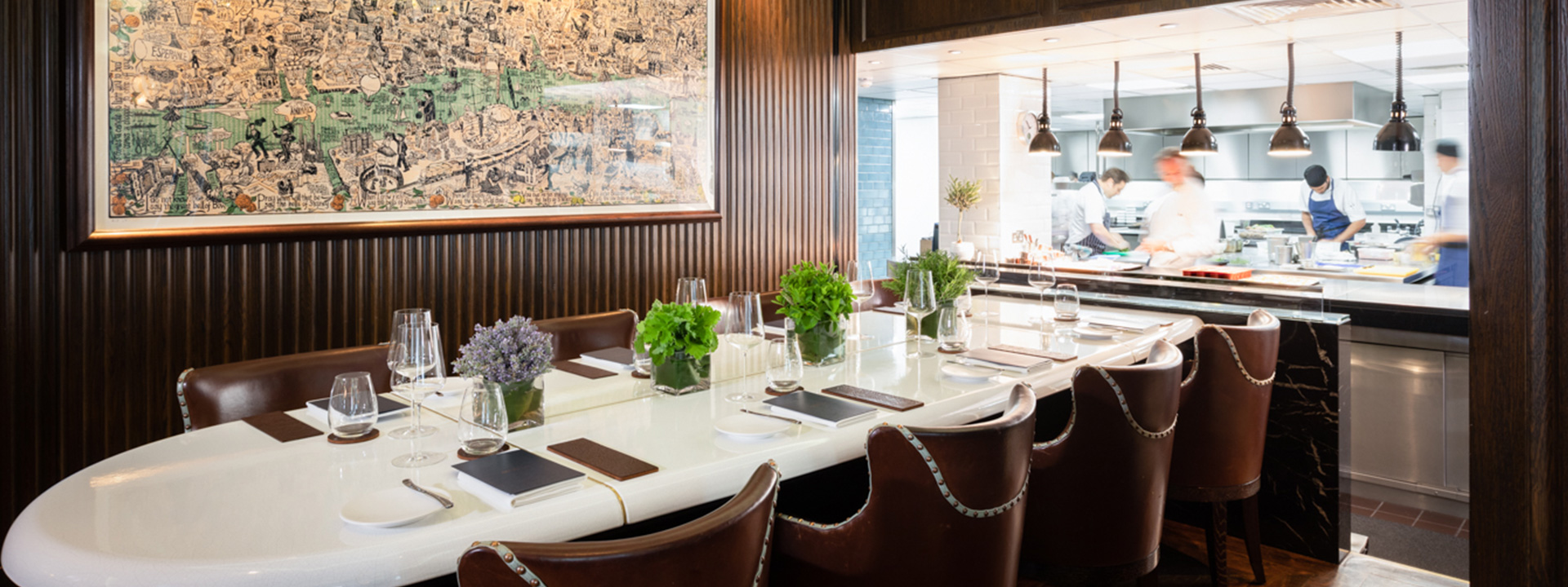 The Chefs Table at Marcus private dining experience with open view to chefs kitchen and a long table adjoining at The Berkeley