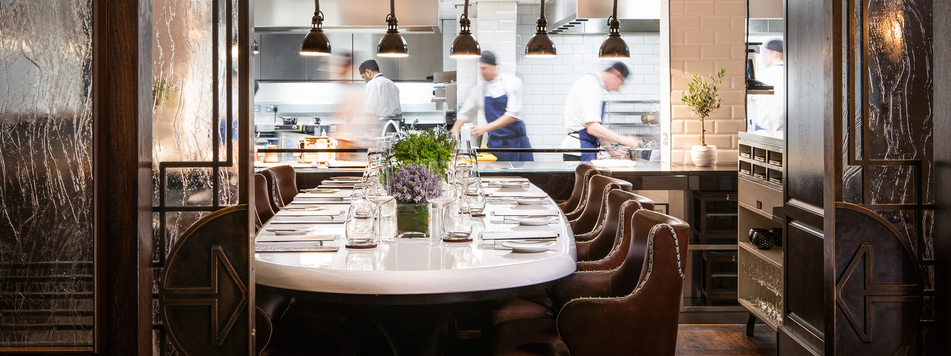 The Chefs Table at Marcus private dining experience with open view to chefs kitchen and a long table adjoining at The Berkeley