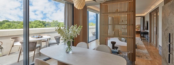 Dining table and chairs in Hyde Park Penthouse with light and airy feel and terrace with chairs